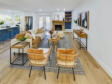 Bright modern living room with wooden furniture and cozy seating.