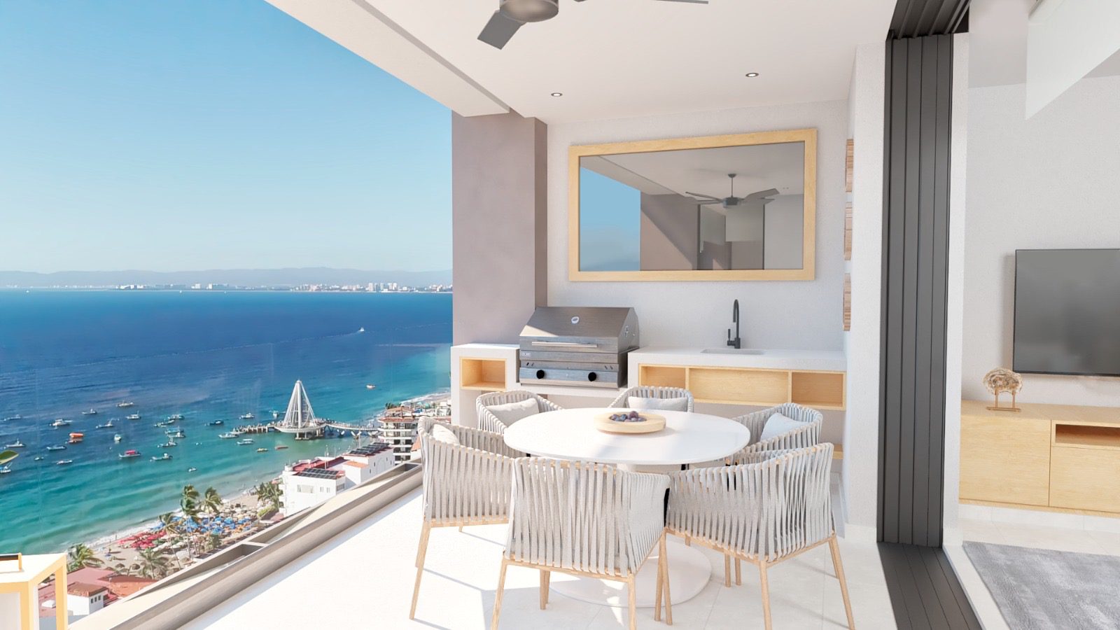 Elegant outdoor dining area overlooking a stunning ocean view with sailboats.